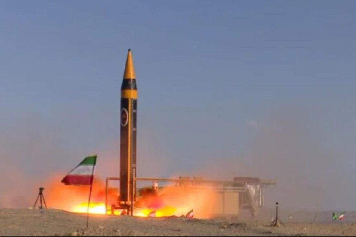 Iranian ballistic missile launch with Iranian flag