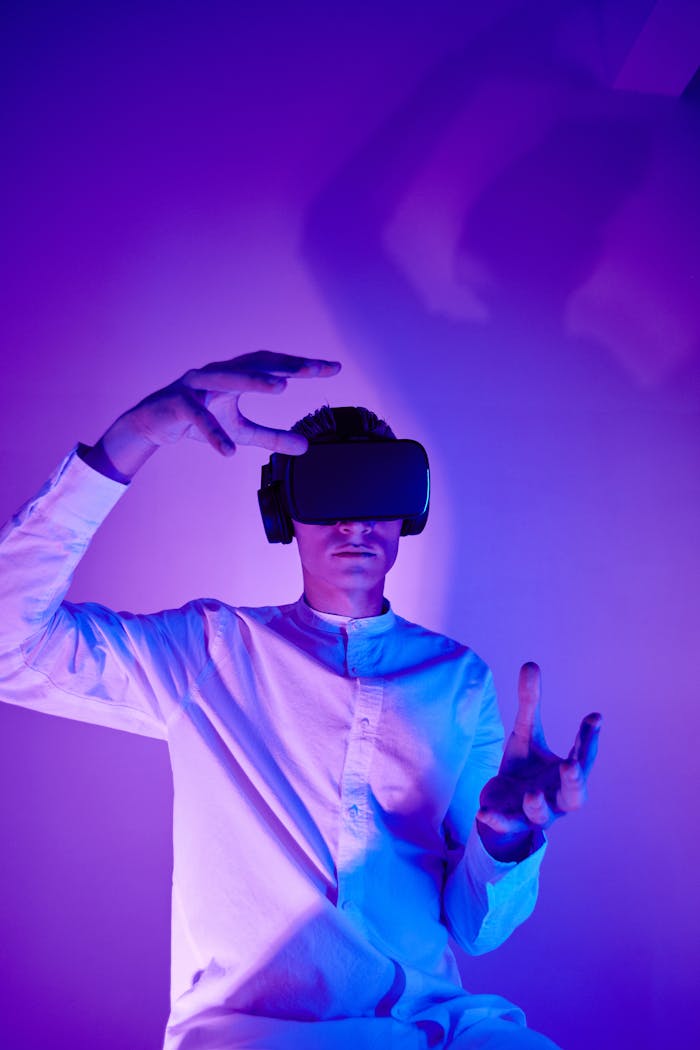 A man immersed in virtual reality wearing VR goggles in a modern studio setup.